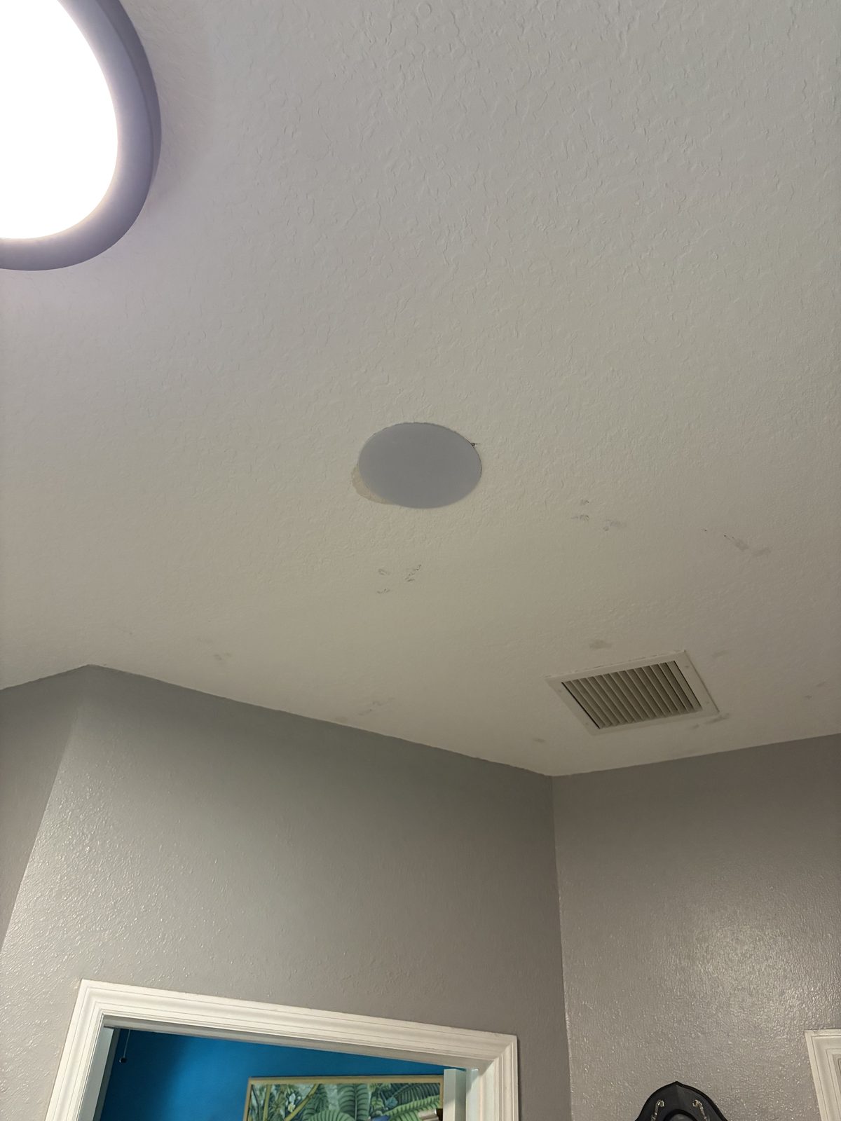 Flush in-ceiling speaker painted to match ceiling