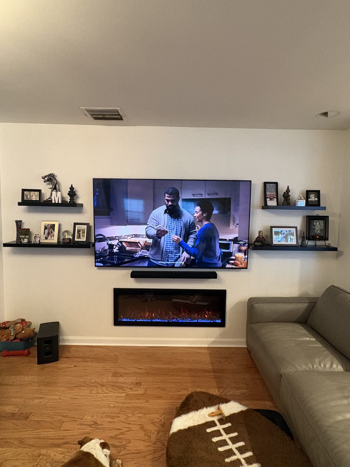 Wall-mounted TV and soundbar in living room install