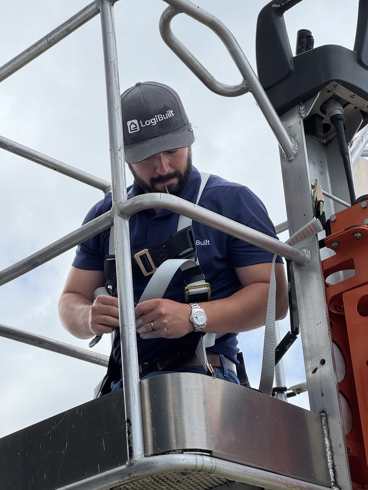 LogiBuilt installer harnessed on a boom lift